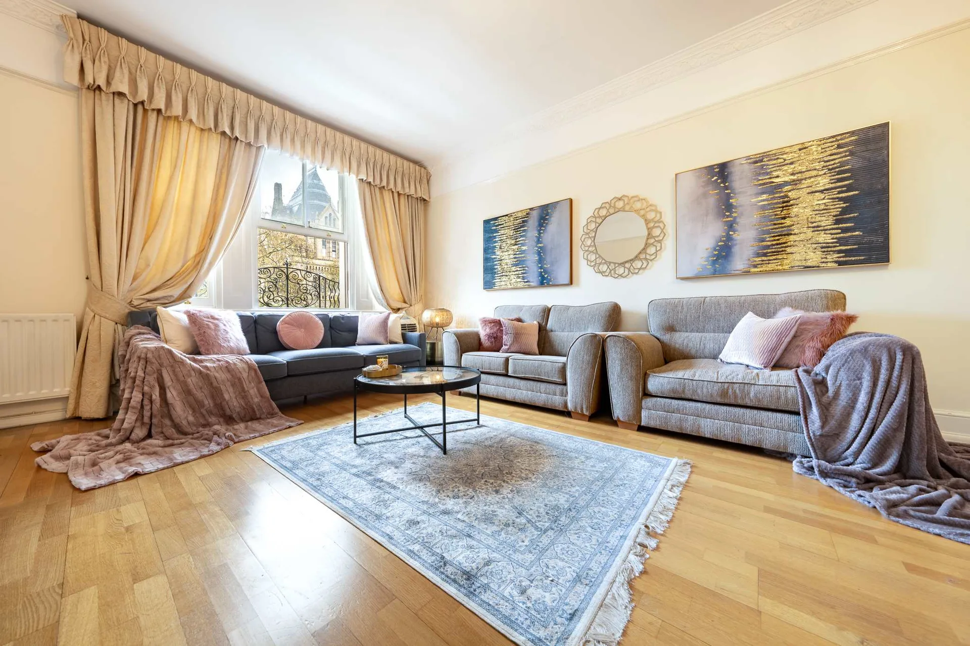 Stylish serviced apartment living room with bay window in London